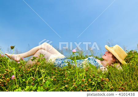Young girl laying in meadow Young girl laying in meadow 4101438