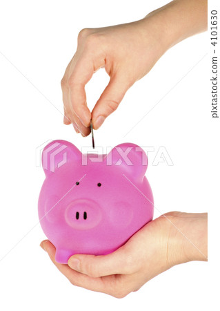 Hand putting coin in piggy bank 4101630