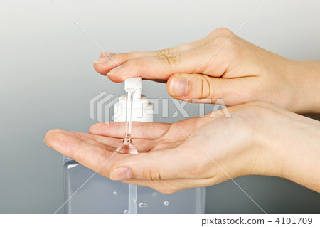 Hands applying sanitizer gel Hands applying sanitizer gel 4101709