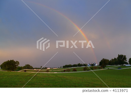 Rainbow over a horse farm 4113971