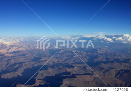 Aerial photograph of the Andes Mountains in the summer that runs north and south from the eastern part of South America Chile. 4127038