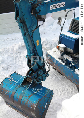 A shovel clearing snow from a residential area A shovel clearing snow from a residential area 4150145
