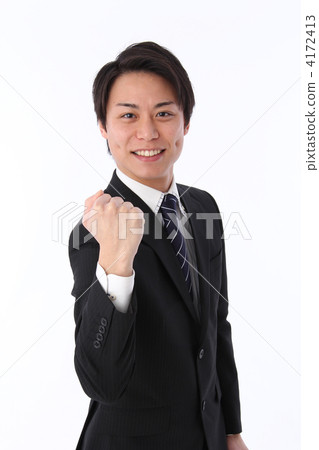 A man in a suit with a guts pose A man in a suit with a guts pose 4172413