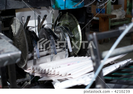 ready newspaper on production line in a print shop ready newspaper on production line in a print shop 4210239