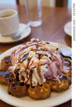 Waffles with ice cream and whipped cream 4224766