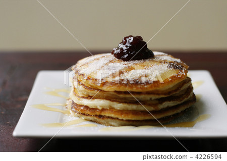 Stack of pancakes with honey and jam. Stack of pancakes with honey and jam. 4226594