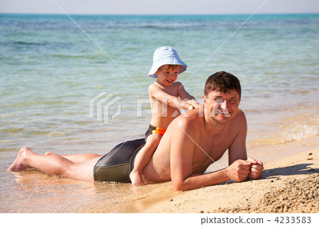 son sit astride a father 4233583
