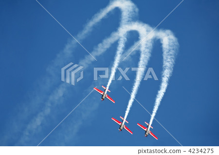 three airplanes Extra EA-300 on airshow 4234275