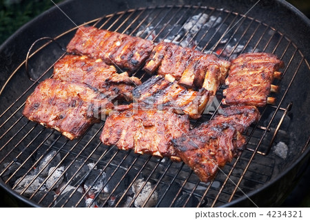grilled pork ribs on bbq grill (shallow DOF) grilled pork ribs on bbq grill (shallow DOF) 4234321