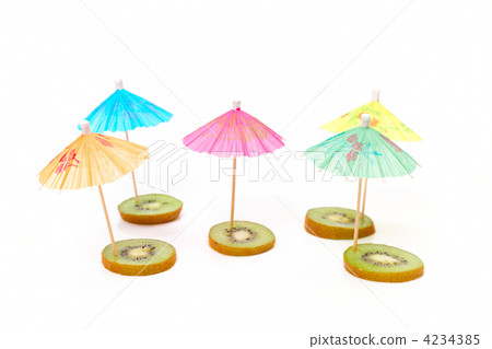 cocktail umbrellas on the slices of kiwi cocktail umbrellas on the slices of kiwi 4234385