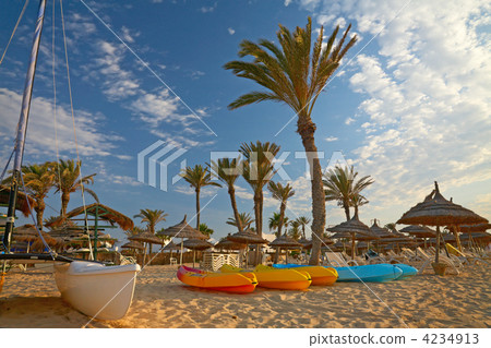 kayaks and catamaran on the beach 4234913