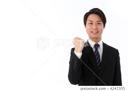 A man in a suit with a guts pose A man in a suit with a guts pose 4247355