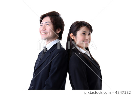 Men and women back to back with a smile wearing a suit 4247382