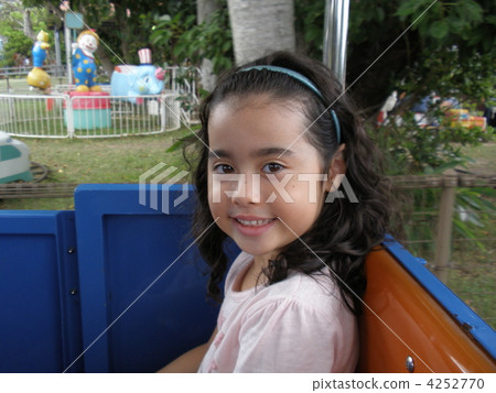 A girl smiling with a plaything 4252770