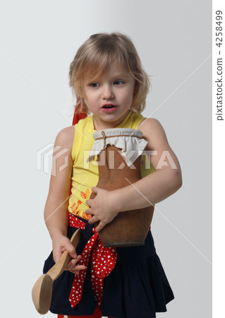 Little girl with a wooden spoon and crock Little girl with a wooden spoon and crock 4258499