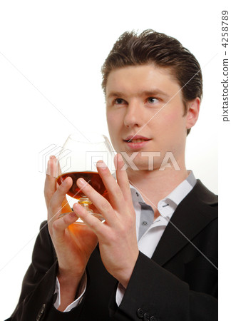 Portrait of a man with a glass of cognac Portrait of a man with a glass of cognac 4258789