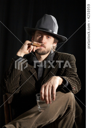 A man with glass of whiskey and cigar A man with glass of whiskey and cigar 4258959