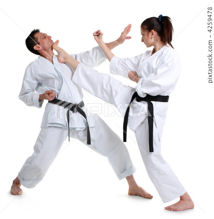 Karate. Young girl and a men in a kimono. Battle sports capture Karate. Young girl and a men in a kimono. Battle sports capture 4259478