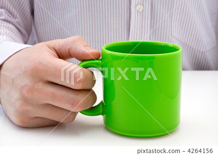 businessman hold a green cup businessman hold a green cup 4264156