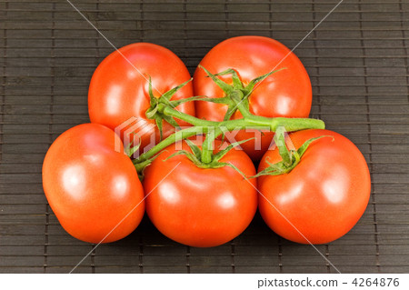 tomatoes on black tablemat tomatoes on black tablemat 4264876