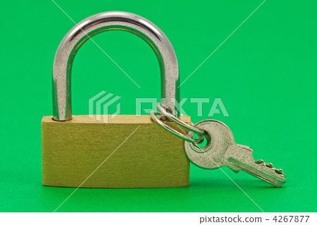 padlock with keys on green background 4267877