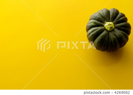 Pumpkin and yellow background Pumpkin and yellow background 4269082