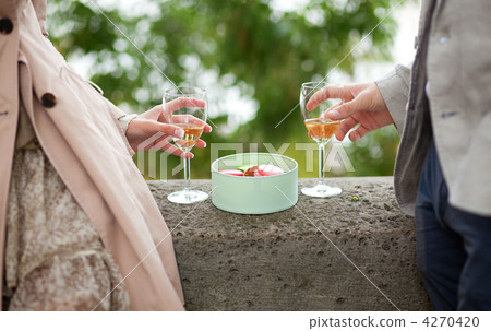 Couple in Paris, eating macaroons and drinking champagne 4270420