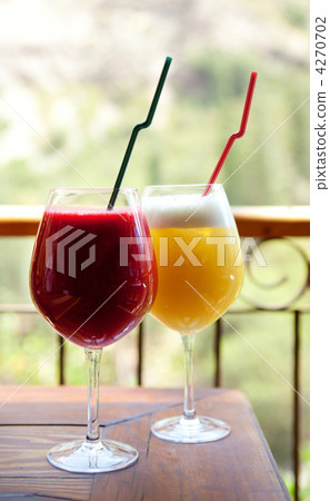 Two fresh fruit juices Two fresh fruit juices 4270702