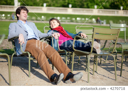 Young french couple relaxing in the Luxembourg Garden of Paris Young french couple relaxing in the Luxembourg Garden of Paris 4270718