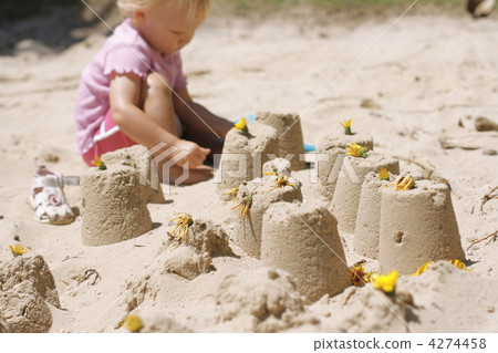 A little girl making sand castles. 4274458