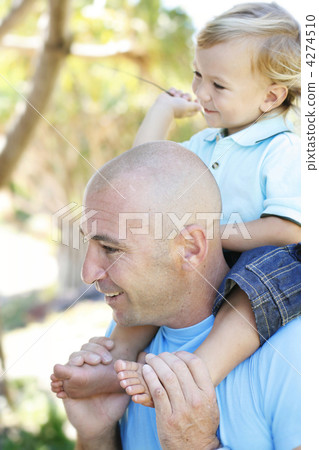 Close-up portrait of a father and son outdoors. Close-up portrait of a father and son outdoors. 4274510