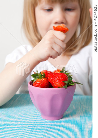 LIttle girl eating strawberries LIttle girl eating strawberries 4274623