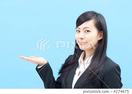 female business person, blue background, dark hair 4274675
