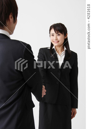 Businessman and business woman who shakes hands in a suit Businessman and business woman who shakes hands in a suit 4281618