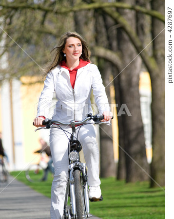 Girl walks city with bicycle Girl walks city with bicycle 4287697
