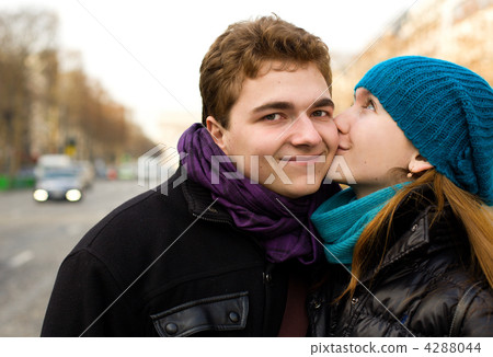 Happy couple in love kissing on the street 4288044