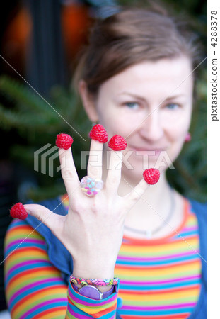 Beautiful young girl in bright clothes poses as Amelie with rasp Beautiful young girl in bright clothes poses as Amelie with rasp 4288378