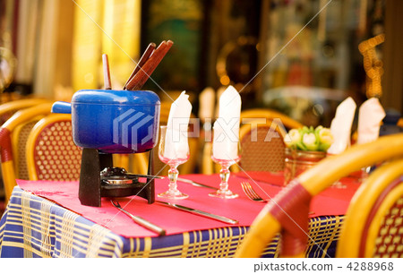 Parisian street cafe with an earthenware pot (caquelon) for fond 4288968