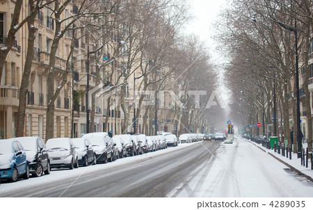 Winter in Paris. Parisian street covered with snow 4289035