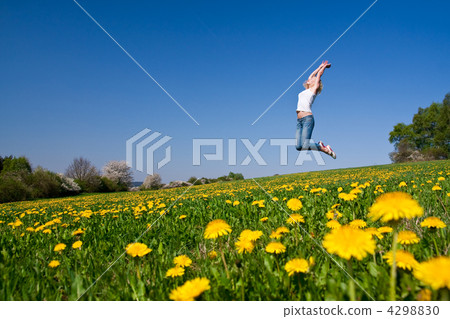 happy young woman on meadow 4298830