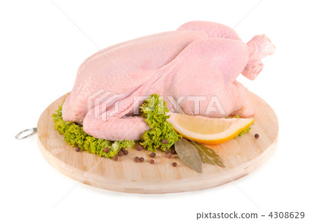 Fresh raw chicken and condiments on wooden board Fresh raw chicken and condiments on wooden board 4308629