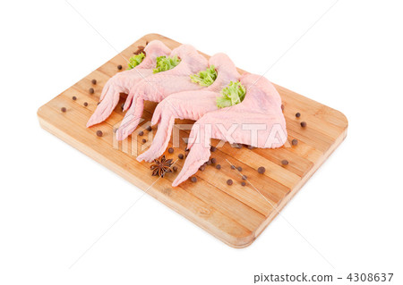 Raw chicken wings on chopping board Raw chicken wings on chopping board 4308637