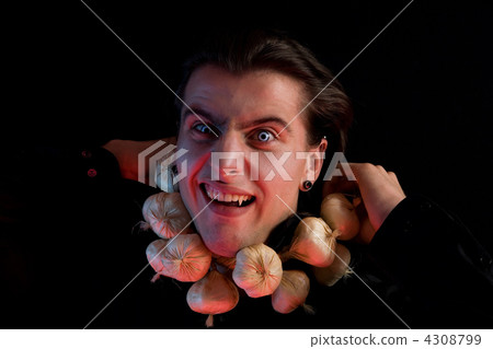Funny vampire suffocated from being choked by garlic Funny vampire suffocated from being choked by garlic 4308799
