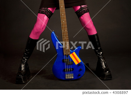 Close-up of woman legs with guitar 4308897