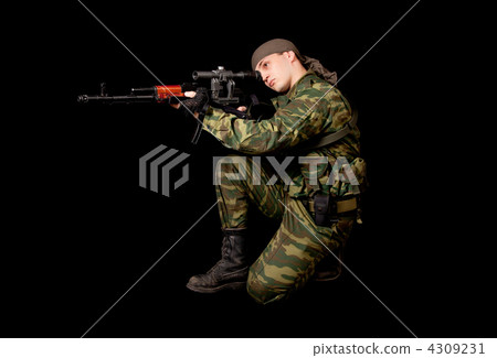 Soldier in uniform with rifle 4309231