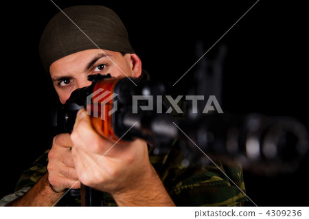Soldier in uniform with rifle 4309236