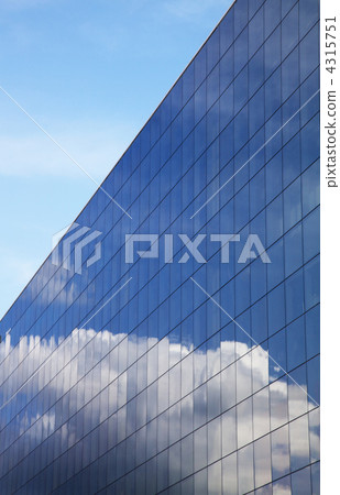 Modern office building and blue sky reflection 4315751