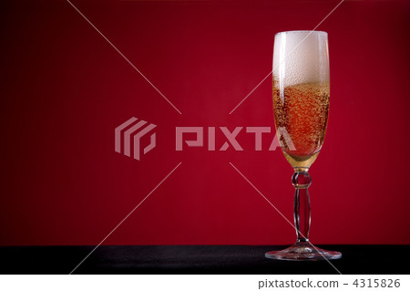 Champagne glass over red background 4315826