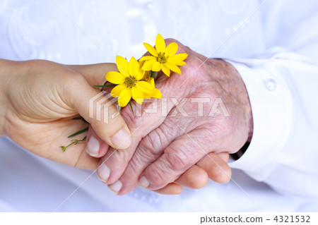 Senior with young flowers and young hands 4321532
