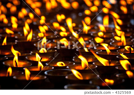 Burning candles in Buddhist temple. McLeod Ganj, Himachal Prades 4325569